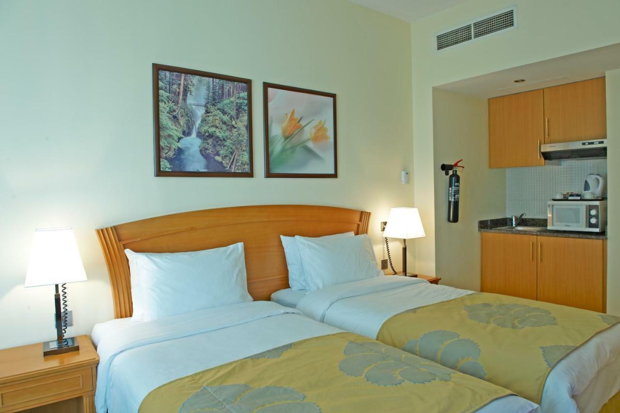 Golden Tulip Sharjah Aparthotel Luaran gambar
